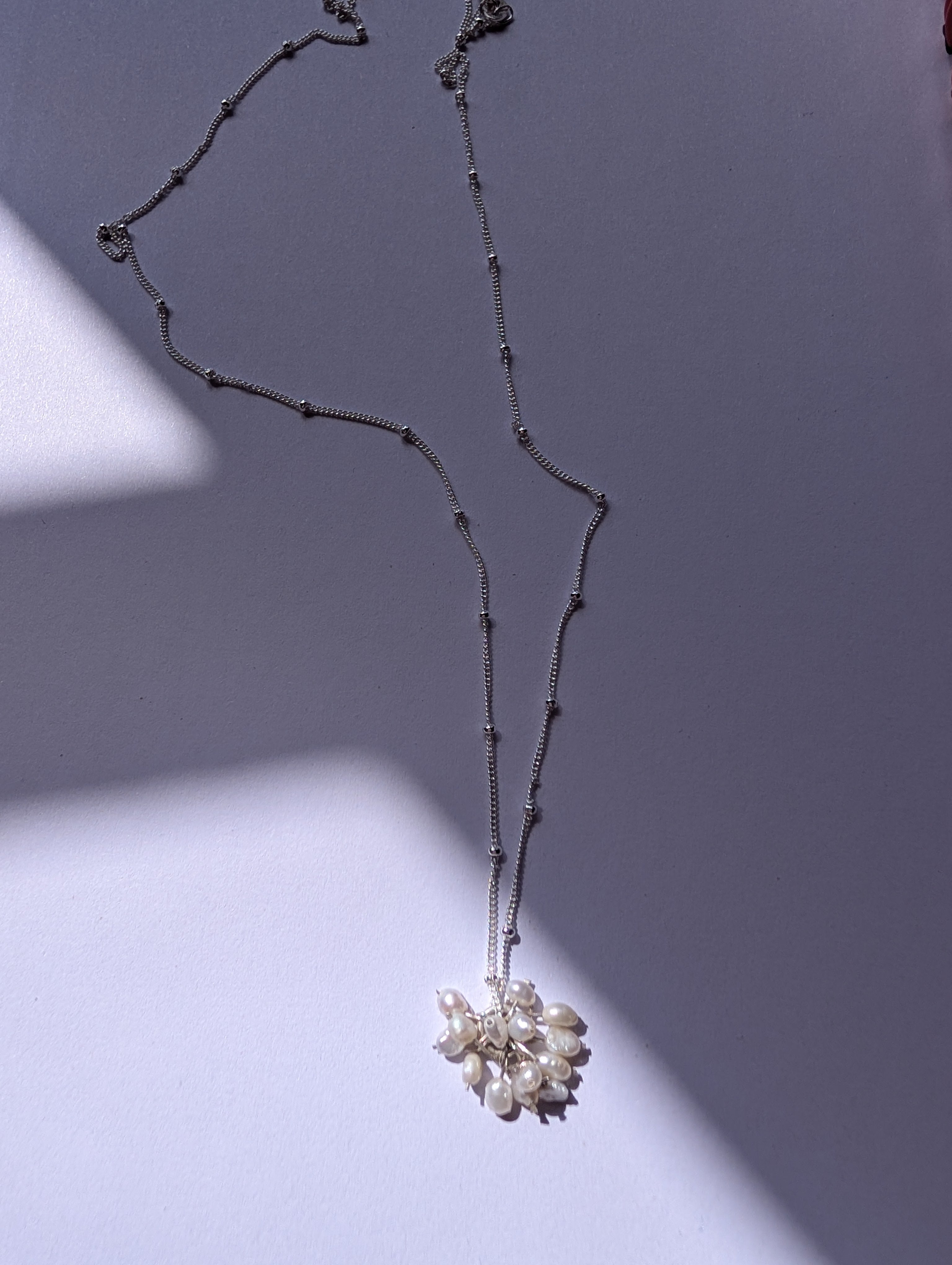 Pearl charm necklace