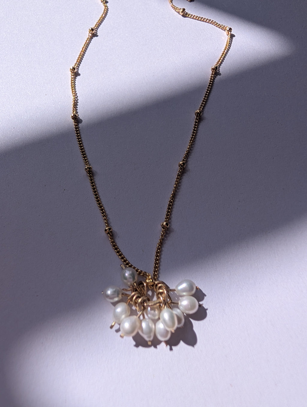 Pearl charm necklace