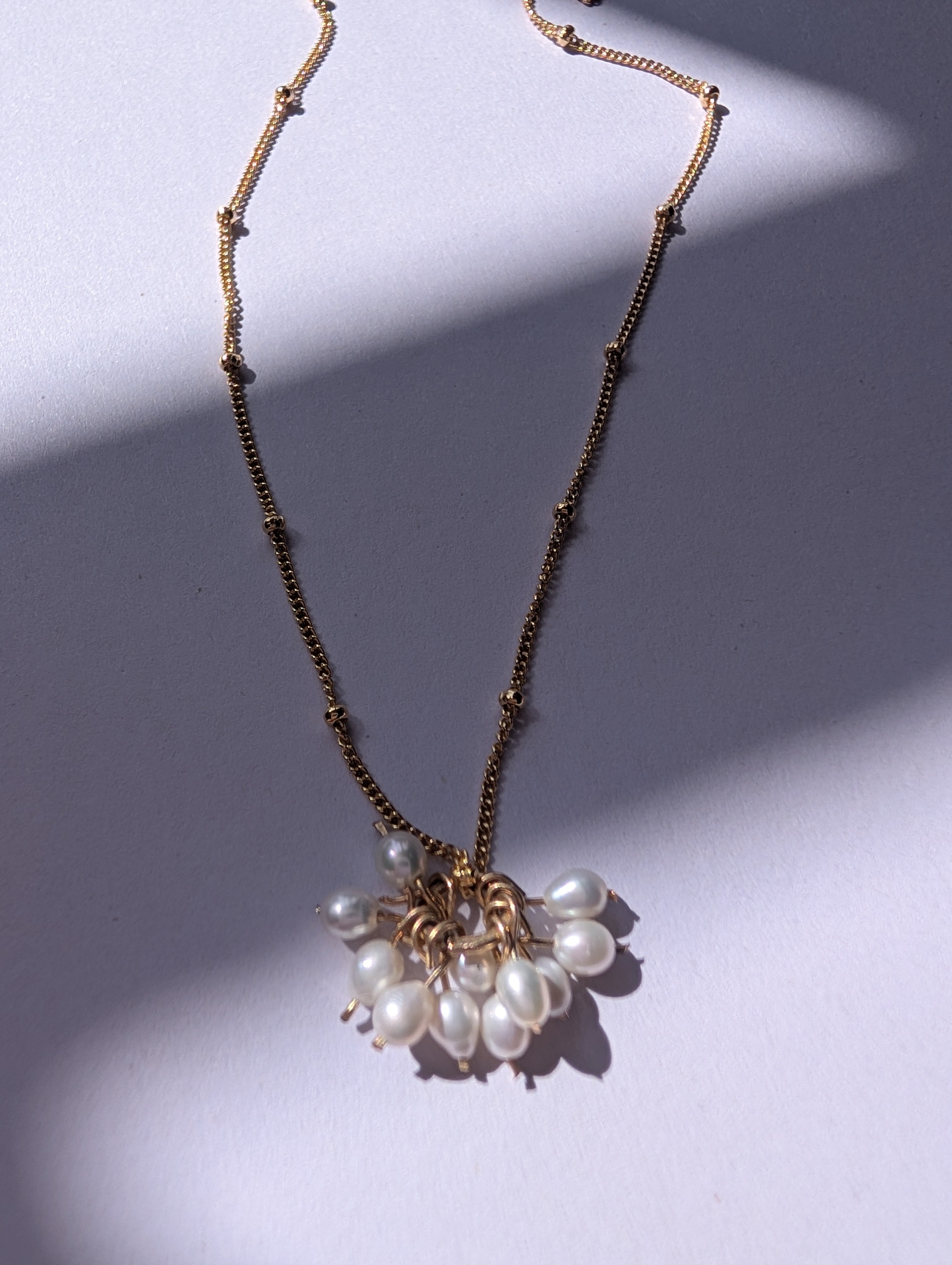 Pearl charm necklace