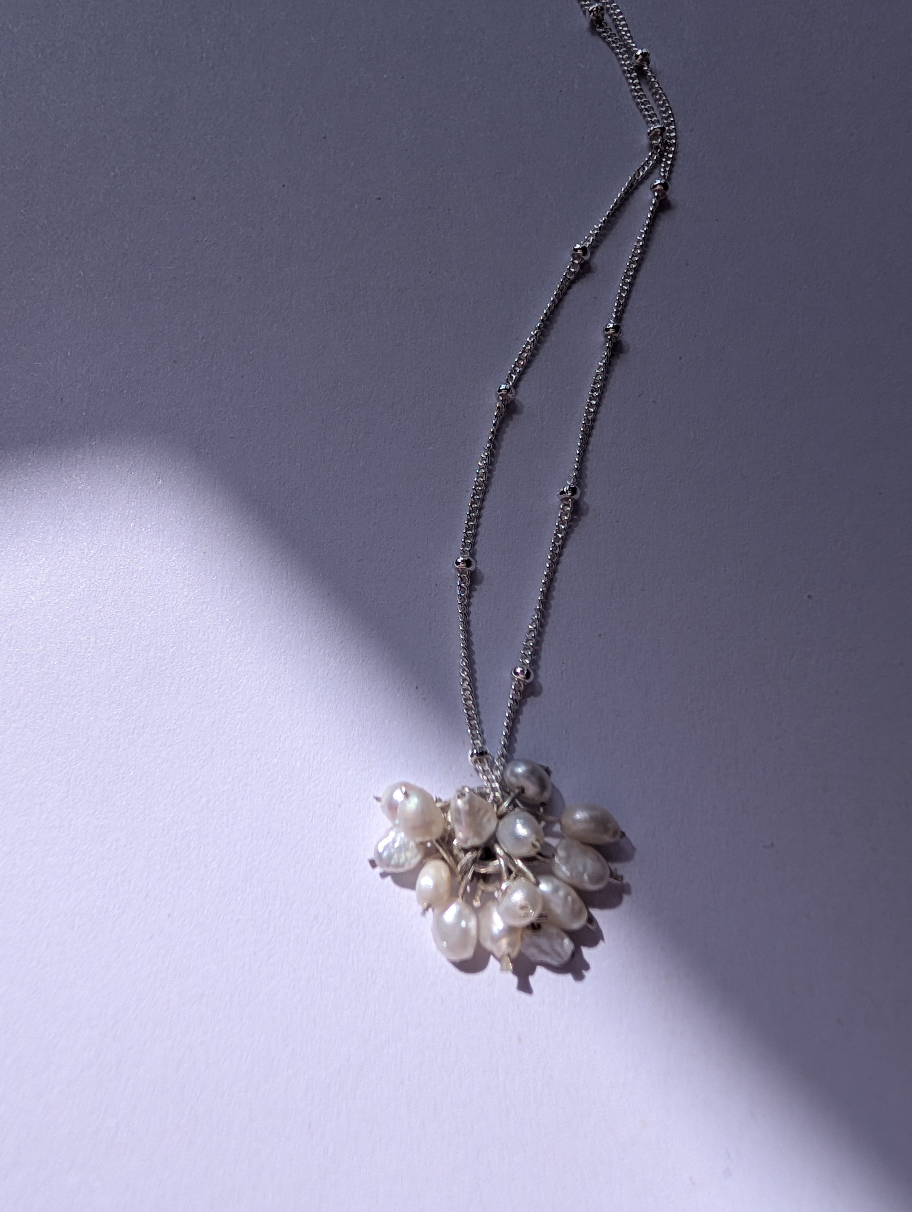 Pearl charm necklace