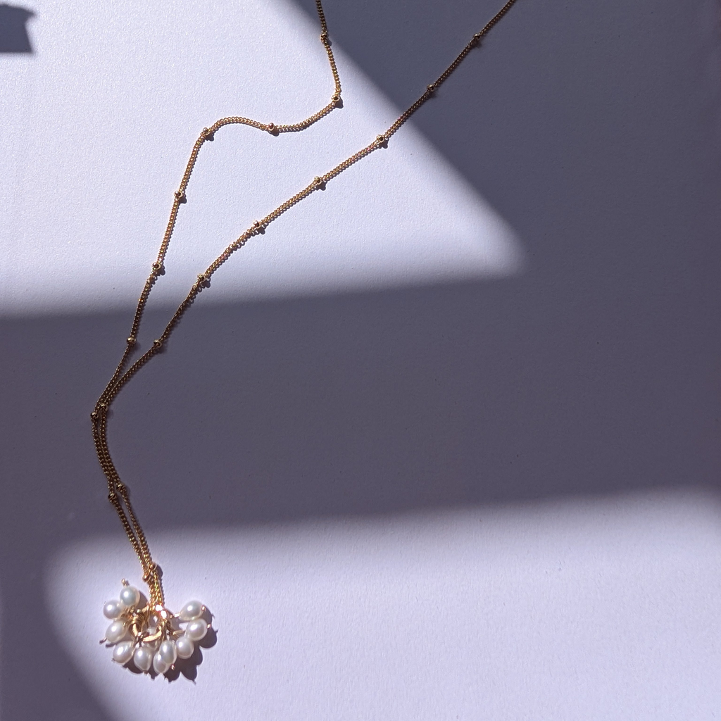 Pearl charm necklace