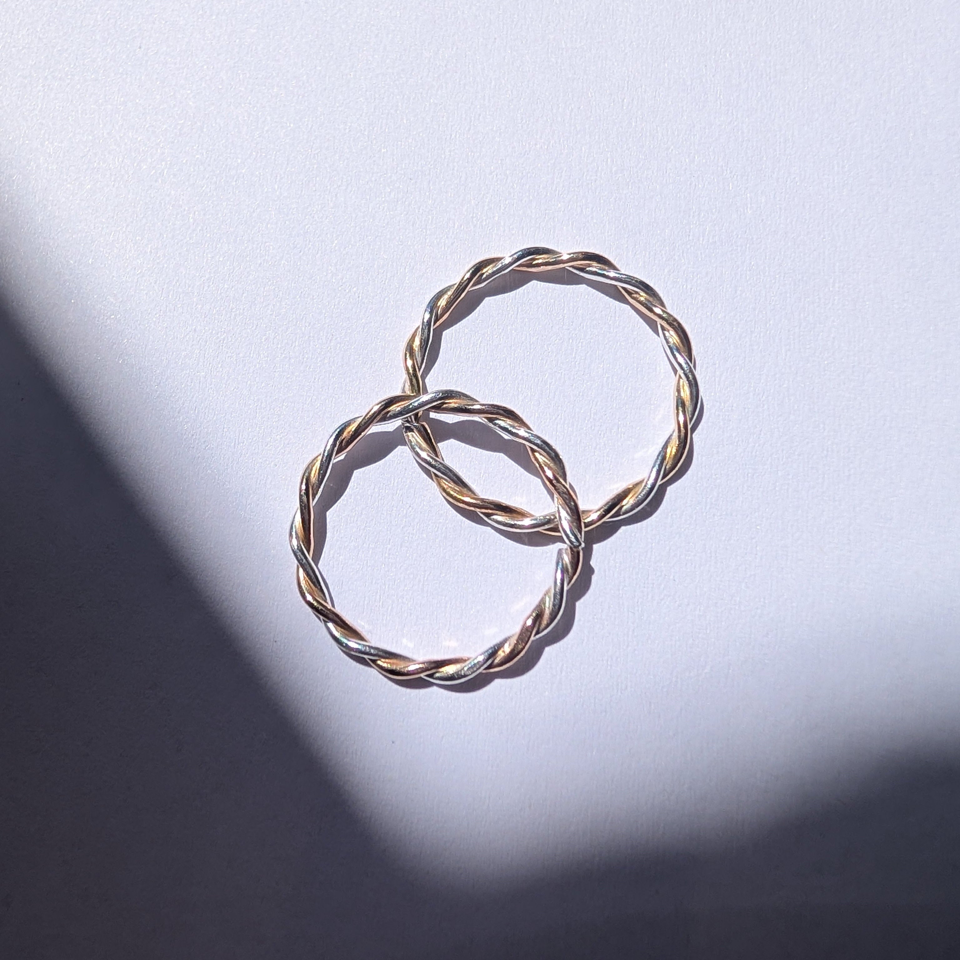 Skinny two tone twist stacker ring